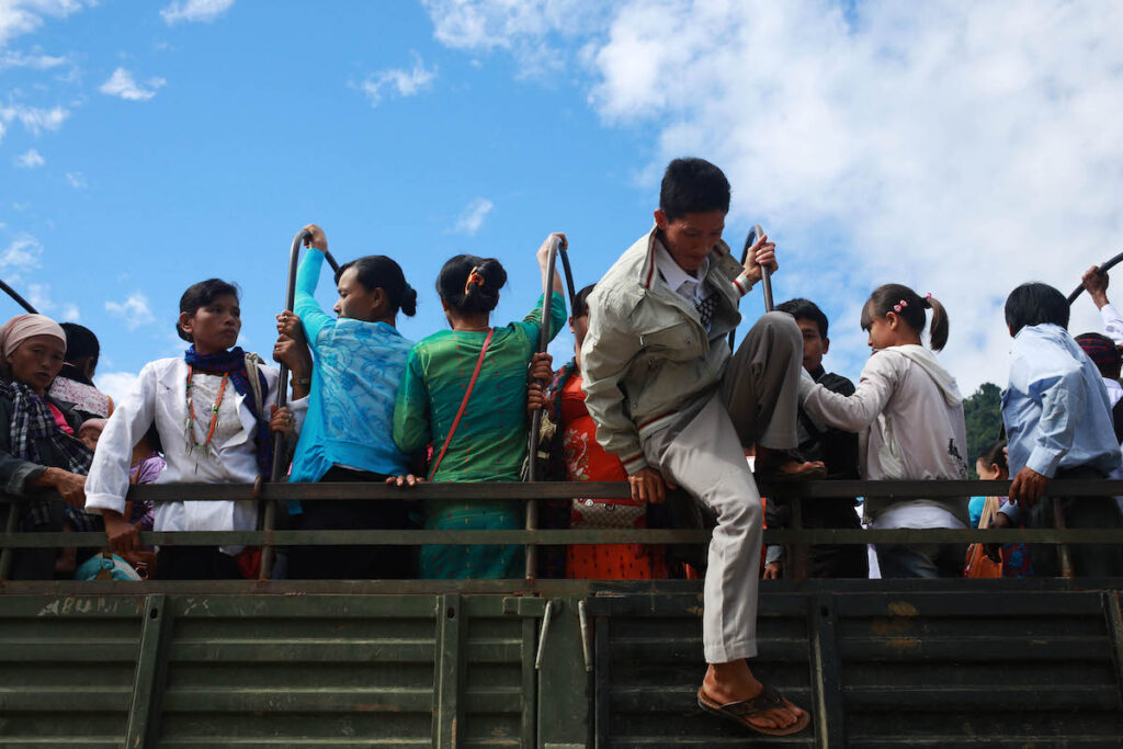 People from the Je Yang camp crowd onto a truck for a trip to Laiza.