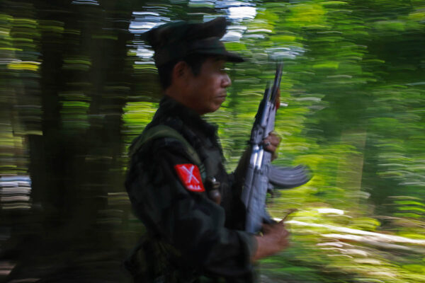 A soldier of Kachin Independence Army (KIA) runs to his position at the frontline of Lawa Yang area in Kachin State.